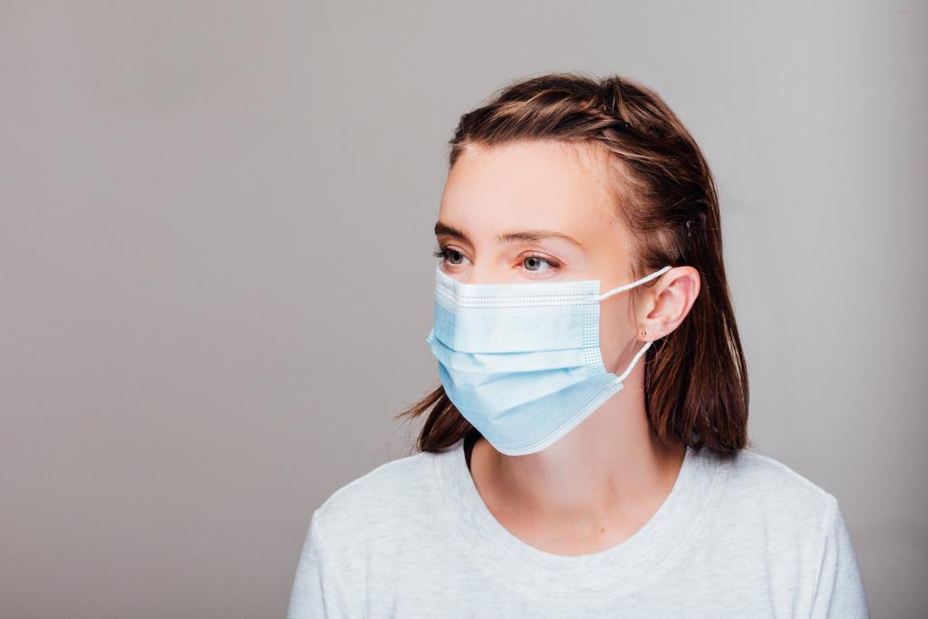 portrait of a woman wearing disposable face mask 1024x683 1