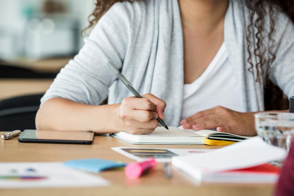 woman at work taking notes 1024x683 1